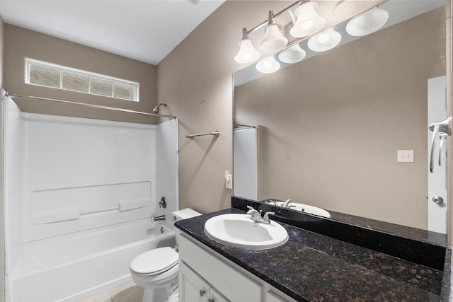 full bathroom featuring vanity, tub / shower combination, tile patterned floors, and toilet