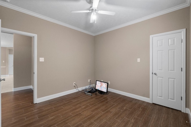 spare room featuring ornamental molding and ceiling fan