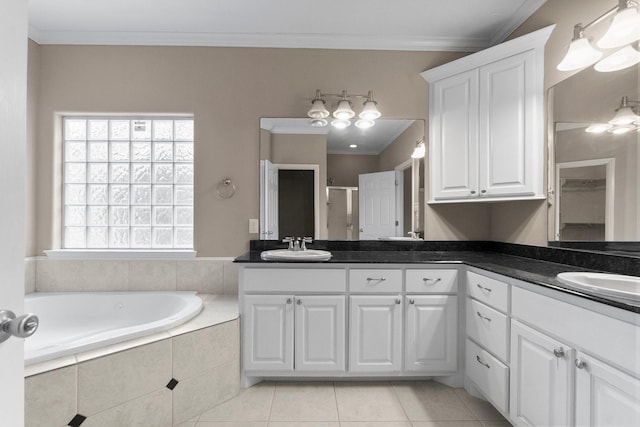 bathroom with crown molding, vanity, and tile patterned flooring