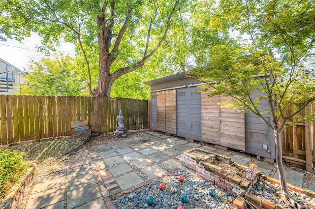 view of patio with an outdoor structure