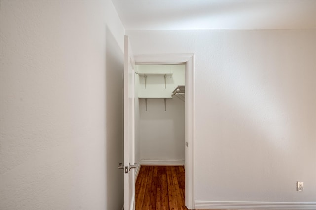 hallway with dark hardwood / wood-style floors