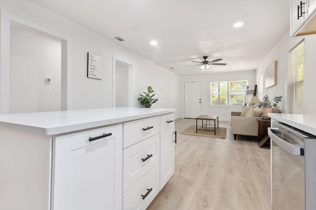 kitchen with white cabinets, light hardwood / wood-style flooring, dishwasher, and ceiling fan