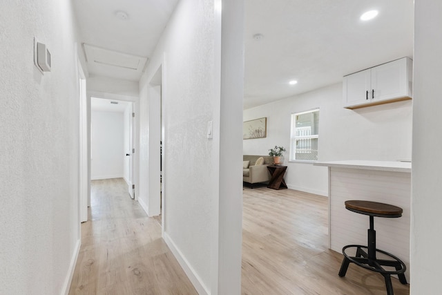 hall with light wood-type flooring