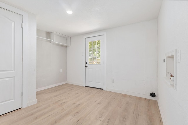 laundry room featuring light hardwood / wood-style flooring