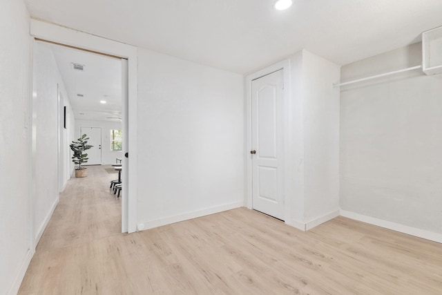 corridor featuring light hardwood / wood-style floors