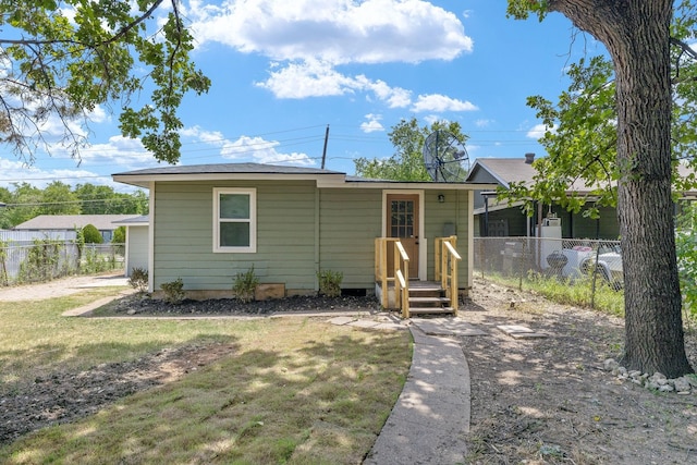 view of front of property with a front lawn