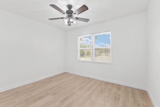 empty room featuring ceiling fan and light hardwood / wood-style flooring