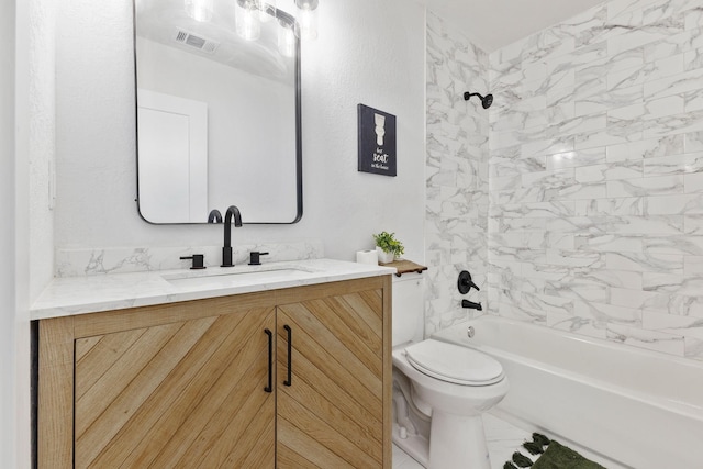 full bathroom with vanity, toilet, and tiled shower / bath combo