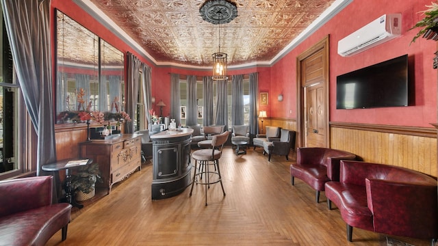 bar featuring decorative light fixtures, light parquet floors, ornamental molding, and a wall unit AC