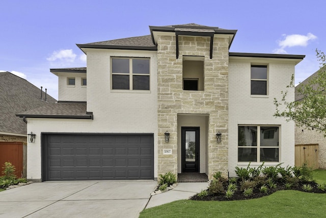 10807 Lighthouse Peak Trce, Richmond, TX 77406 - view of front facade with stone siding, driveway, a garage, and a shingled roof