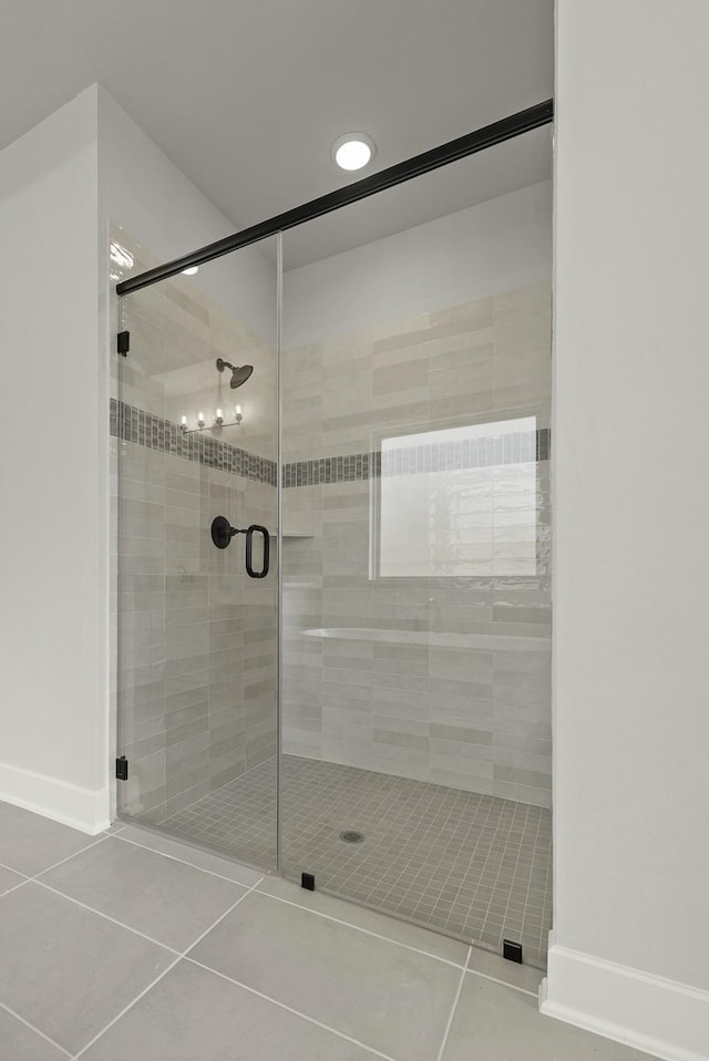 10807 Lighthouse Peak Trce, Richmond, TX 77406 - bathroom with tile patterned floors, a shower stall, and baseboards