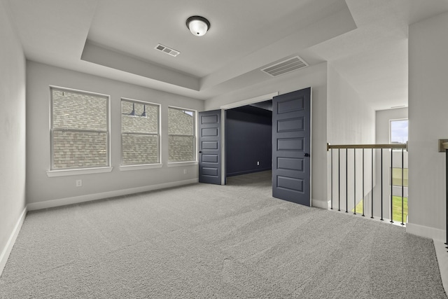 10807 Lighthouse Peak Trce, Richmond, TX 77406 - empty room with carpet floors, baseboards, and a tray ceiling