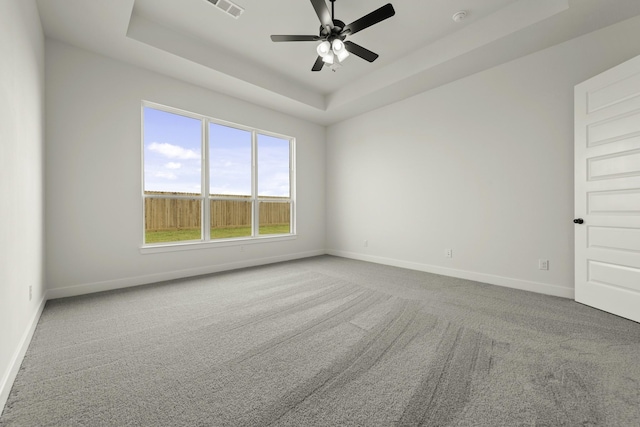 26515 Castra Crescent Trl, Richmond, TX 77406 - carpeted spare room featuring a raised ceiling, baseboards, and ceiling fan