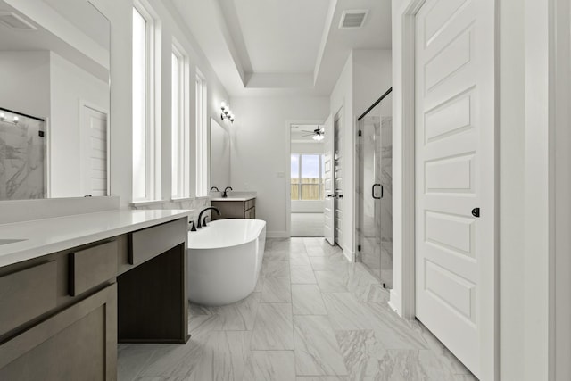 26515 Castra Crescent Trl, Richmond, TX 77406 - bathroom with a marble finish shower, vanity, a ceiling fan, a freestanding bath, and marble finish floors