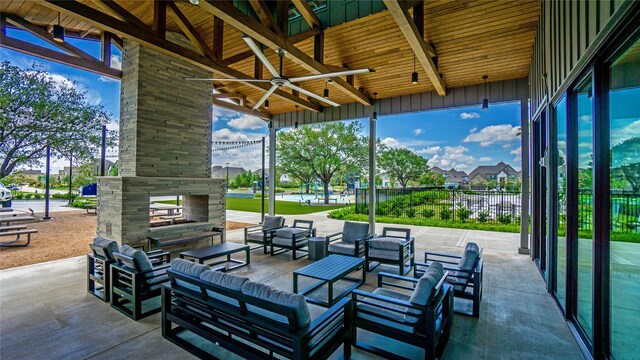 26515 Castra Crescent Trl, Richmond, TX 77406 - view of patio featuring a ceiling fan and an outdoor living space with a fireplace