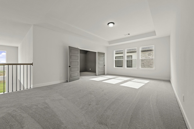 26515 Castra Crescent Trl, Richmond, TX 77406 - carpeted empty room featuring a raised ceiling and baseboards