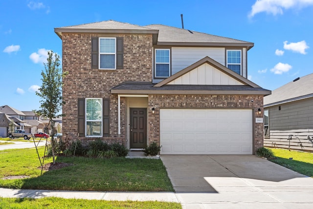 view of front of property featuring a garage and a front lawn