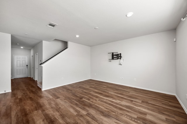 unfurnished room with dark hardwood / wood-style floors