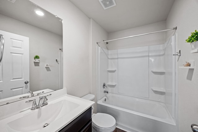 full bathroom featuring tub / shower combination, toilet, and vanity