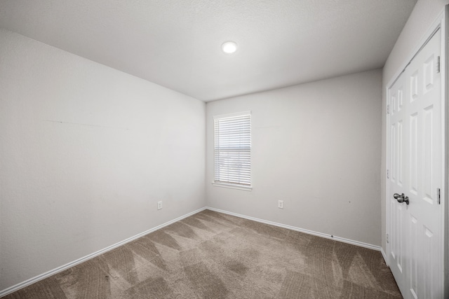 unfurnished bedroom featuring carpet