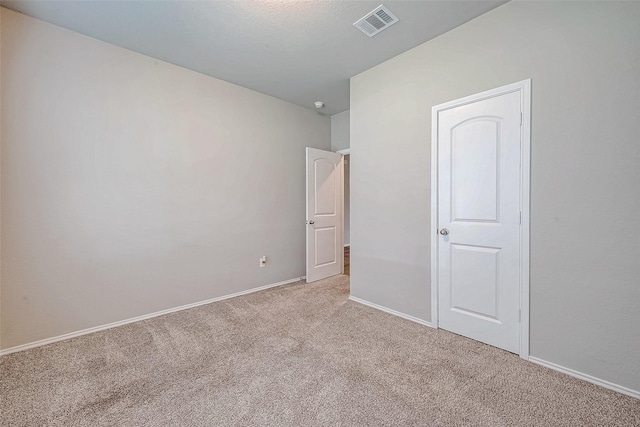 unfurnished bedroom with light colored carpet