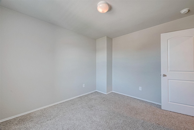 spare room featuring carpet floors