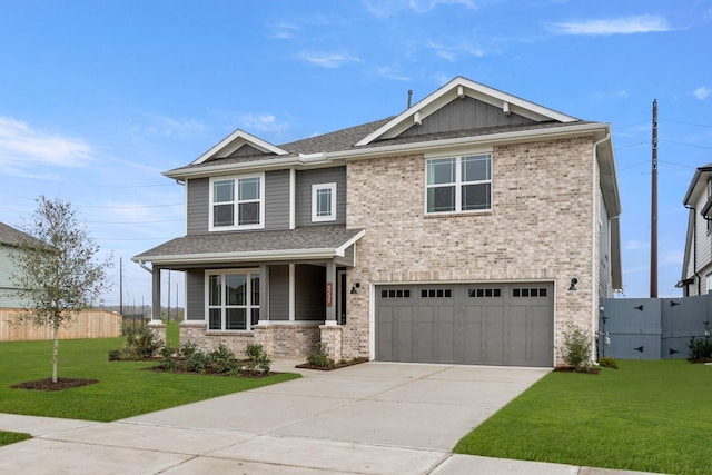 craftsman-style house featuring a front yard, a porch, and a garage