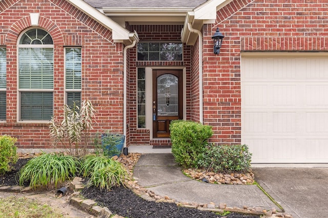 doorway to property featuring a garage