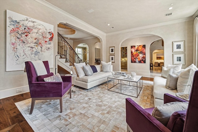 living room featuring light wood-type flooring and ornamental molding