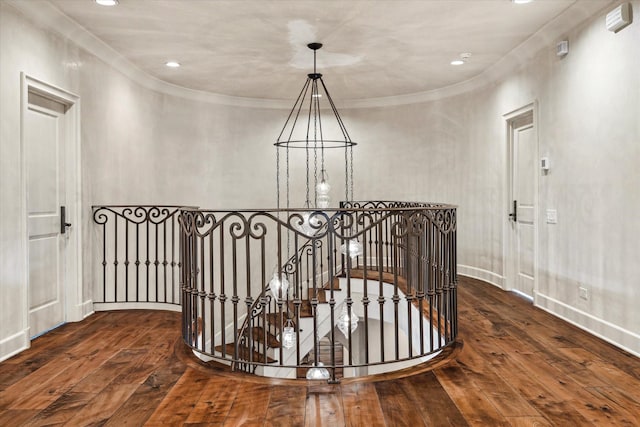 hall featuring dark hardwood / wood-style floors and ornamental molding