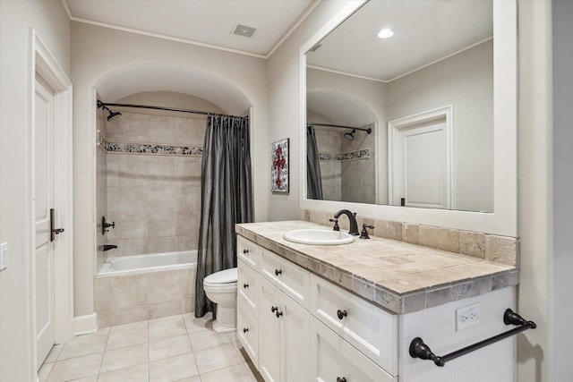 full bathroom featuring shower / bath combination with curtain, toilet, vanity, and tile patterned flooring