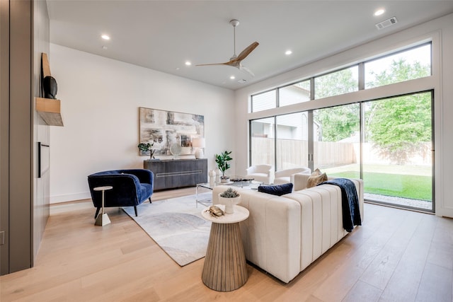 2231 Colquitt St, Houston, TX 77098 - living room featuring light wood-style floors, ceiling fan, and recessed lighting