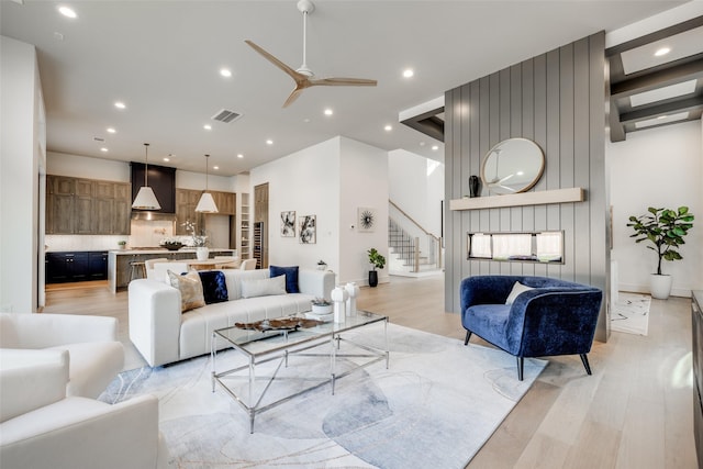 2231 Colquitt St, Houston, TX 77098 - living area with stairway, light wood finished floors, a ceiling fan, recessed lighting, and baseboards
