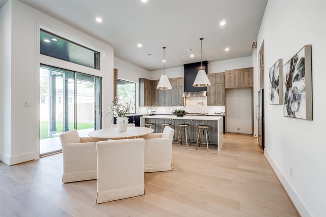 2231 Colquitt St, Houston, TX 77098 - dining area featuring light wood finished floors, recessed lighting, and baseboards
