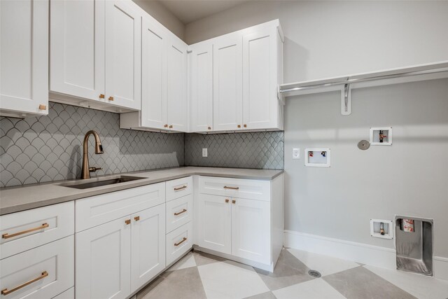 2231 Colquitt St, Houston, TX 77098 - laundry room featuring hookup for a washing machine, cabinet space, and baseboards