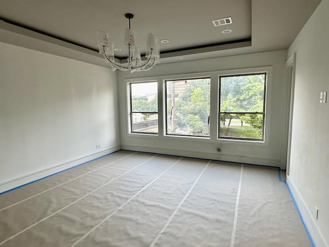 2231 Colquitt St, Houston, TX 77098 - unfurnished dining area featuring a chandelier, a raised ceiling, healthy amount of natural light, and baseboards