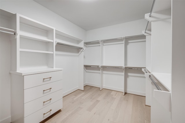 walk in closet featuring light hardwood / wood-style floors