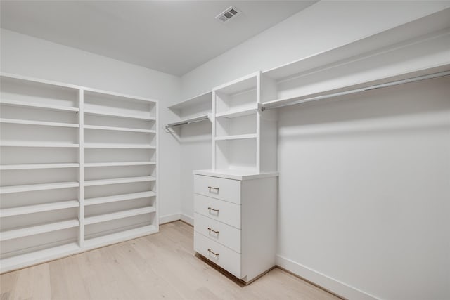 spacious closet featuring light wood-type flooring