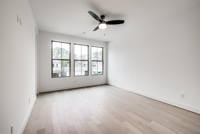 empty room featuring light hardwood / wood-style floors and ceiling fan