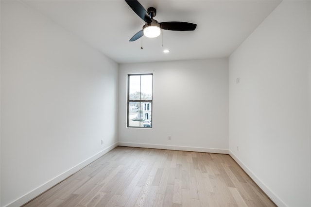 unfurnished room with ceiling fan and light wood-type flooring