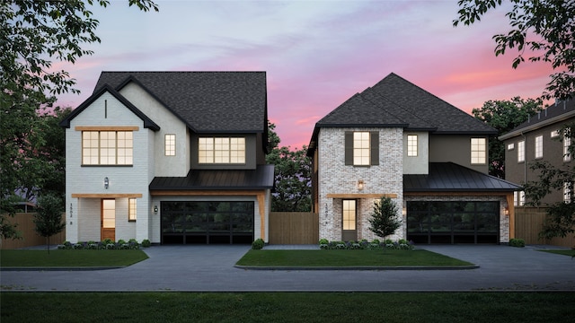 modern farmhouse with a garage and a yard