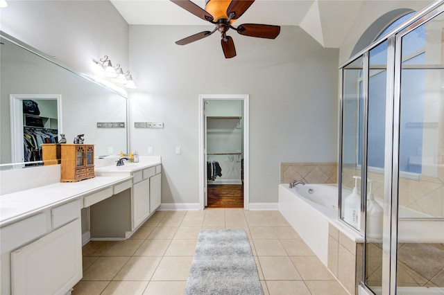 bathroom with tile patterned flooring, vanity, and shower with separate bathtub