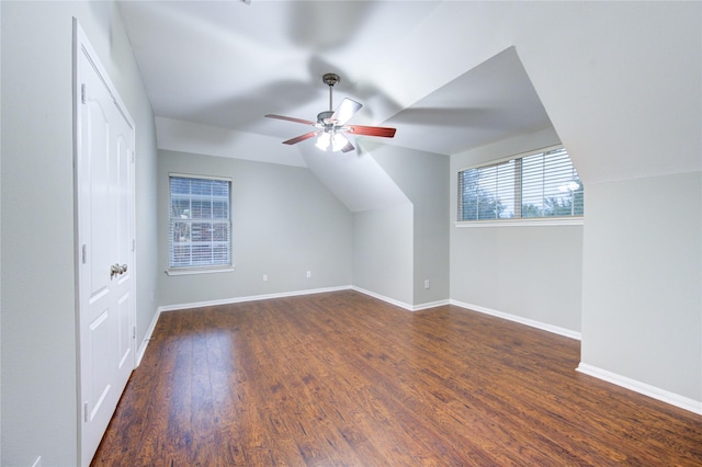 additional living space featuring ceiling fan, dark hardwood / wood-style floors, and lofted ceiling