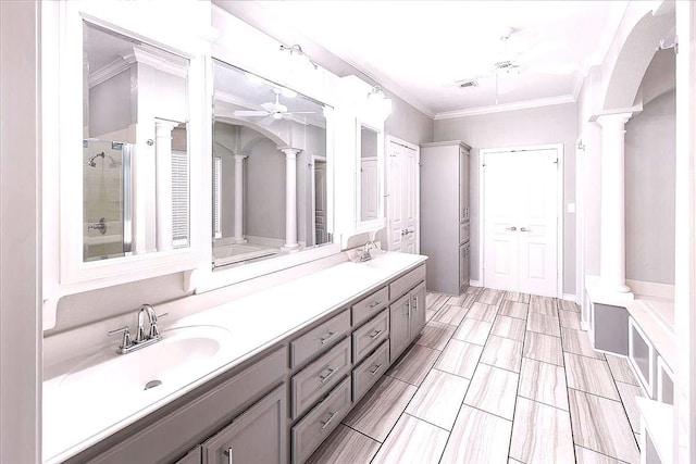 bathroom featuring ornamental molding, independent shower and bath, vanity, and ornate columns