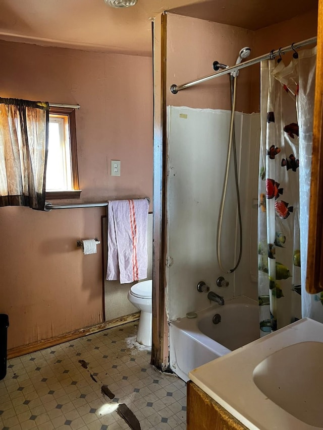 full bathroom with sink, toilet, and shower / bath combination with curtain