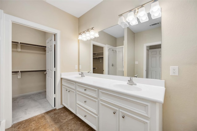 bathroom with vanity and walk in shower