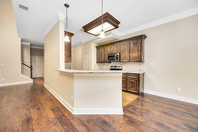 kitchen with dark wood-type flooring, appliances with stainless steel finishes, backsplash, light stone counters, and kitchen peninsula