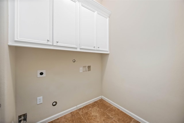 washroom with gas dryer hookup, cabinets, hookup for a washing machine, and electric dryer hookup