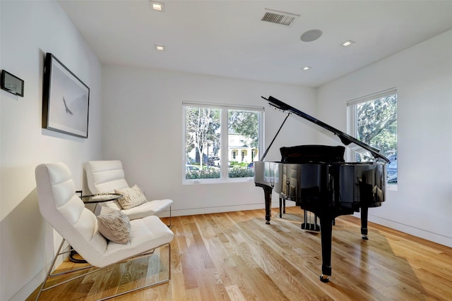 living area with light hardwood / wood-style flooring