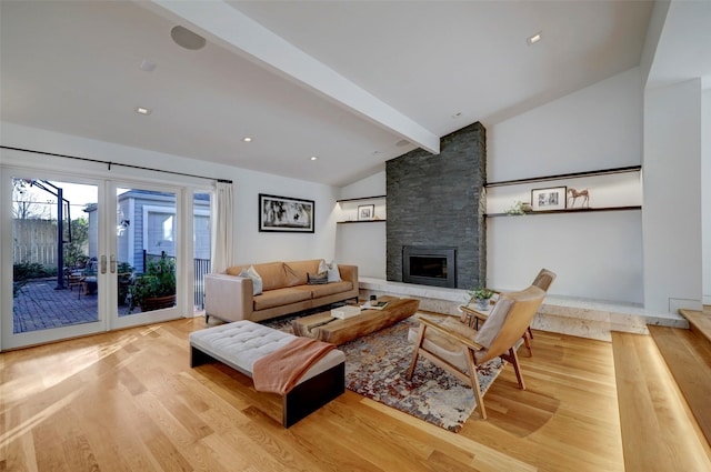 living room featuring french doors, beam ceiling, high vaulted ceiling, light wood-type flooring, and a fireplace